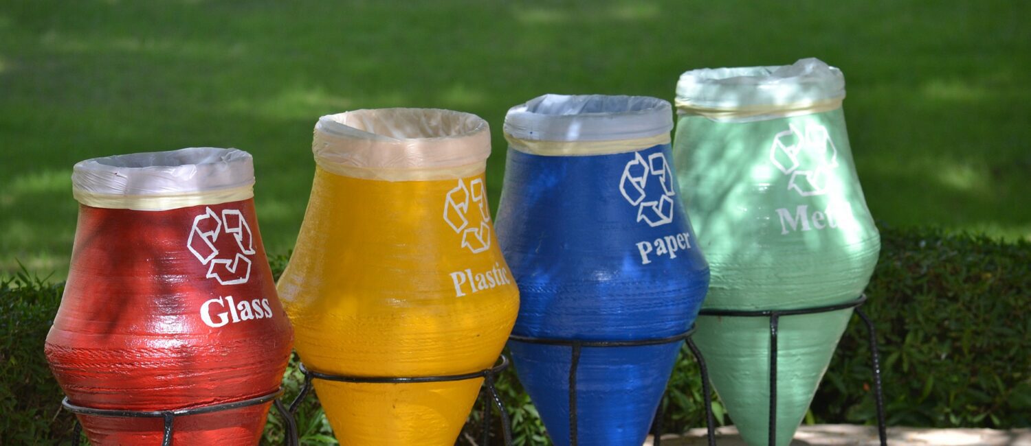 A row of soda bottles sitting on top of metal stands.