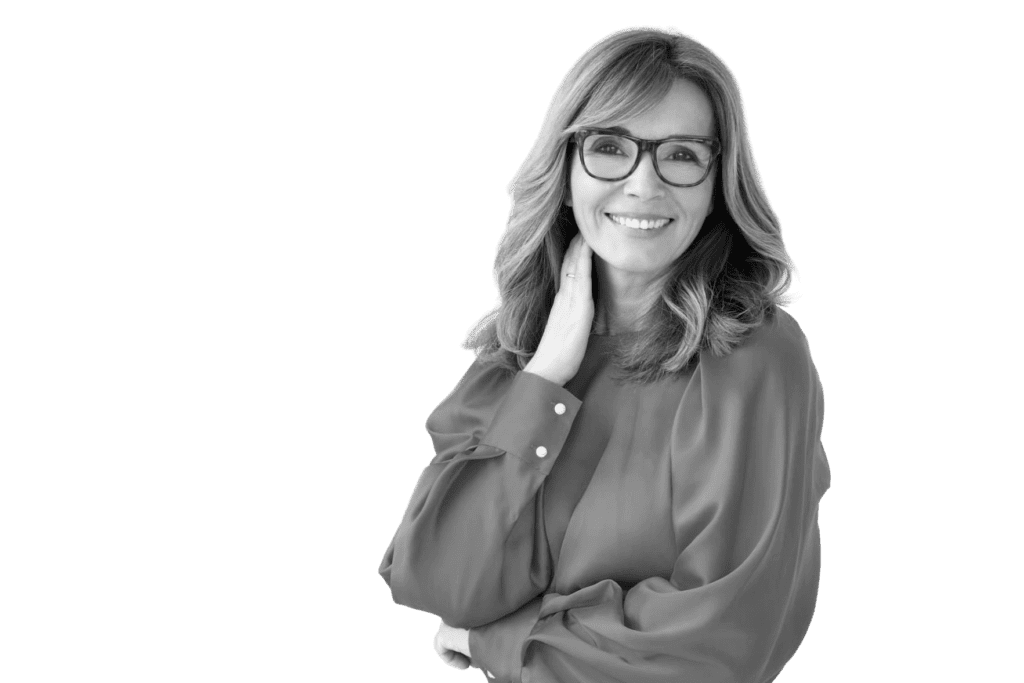 A black and white photo of a woman wearing glasses