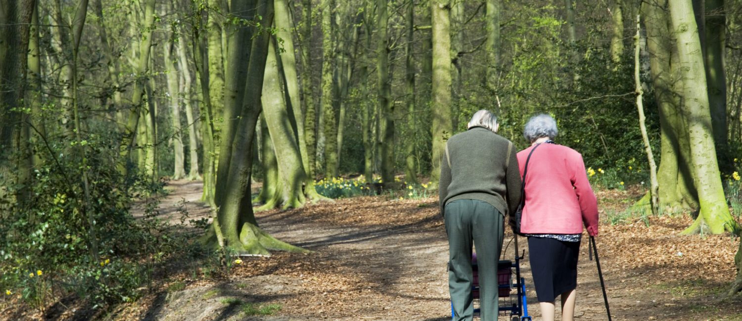 A man and woman walking down the road