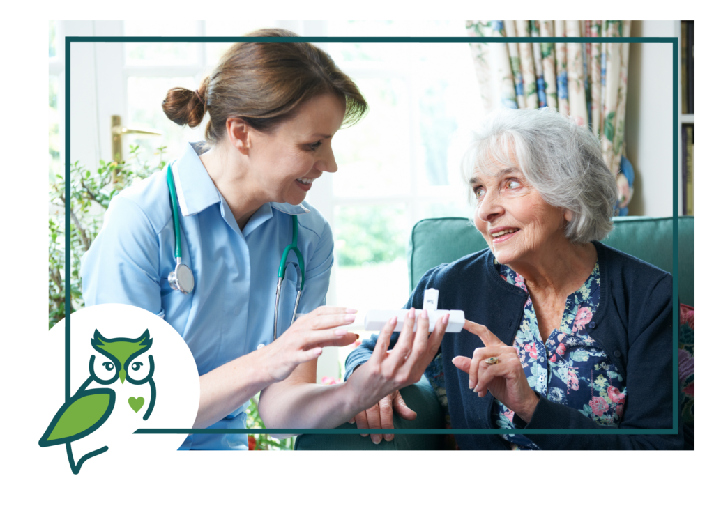 A woman and a nurse are holding something in her hand.