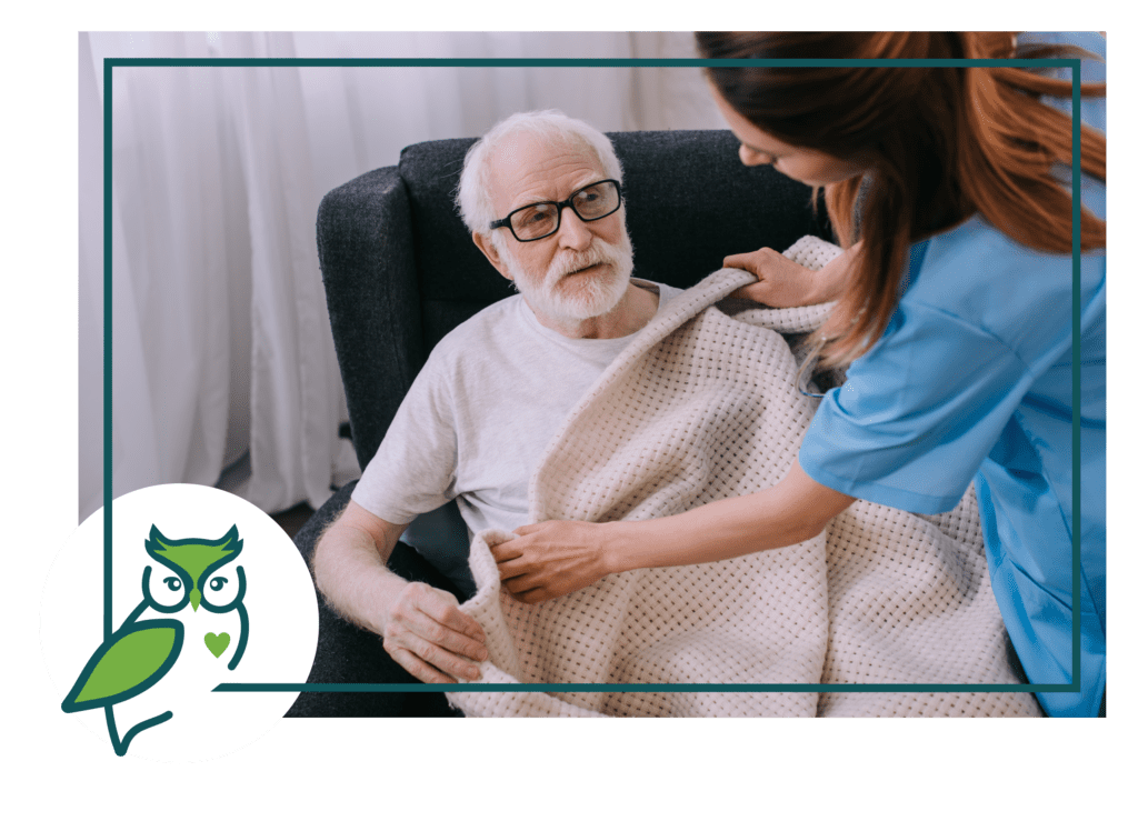 A nurse is caring for an elderly man.