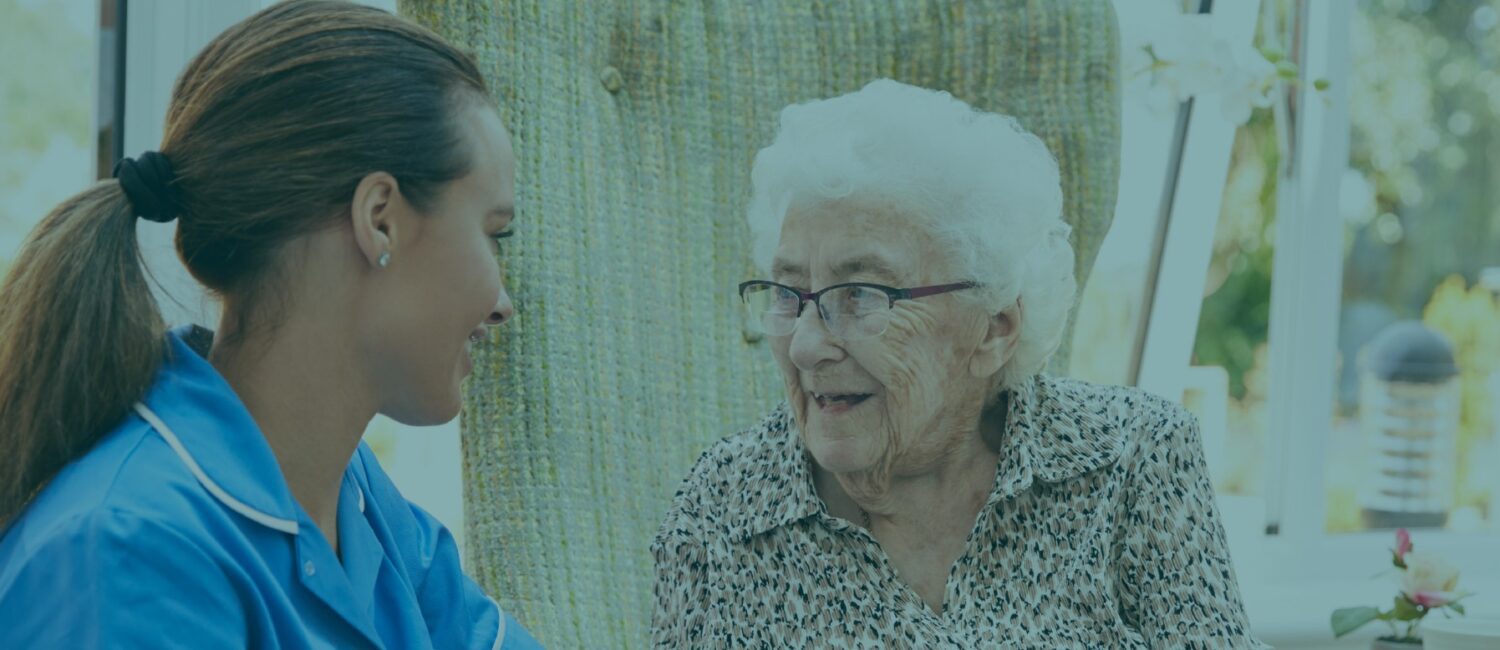 A woman and an older person talking to each other.