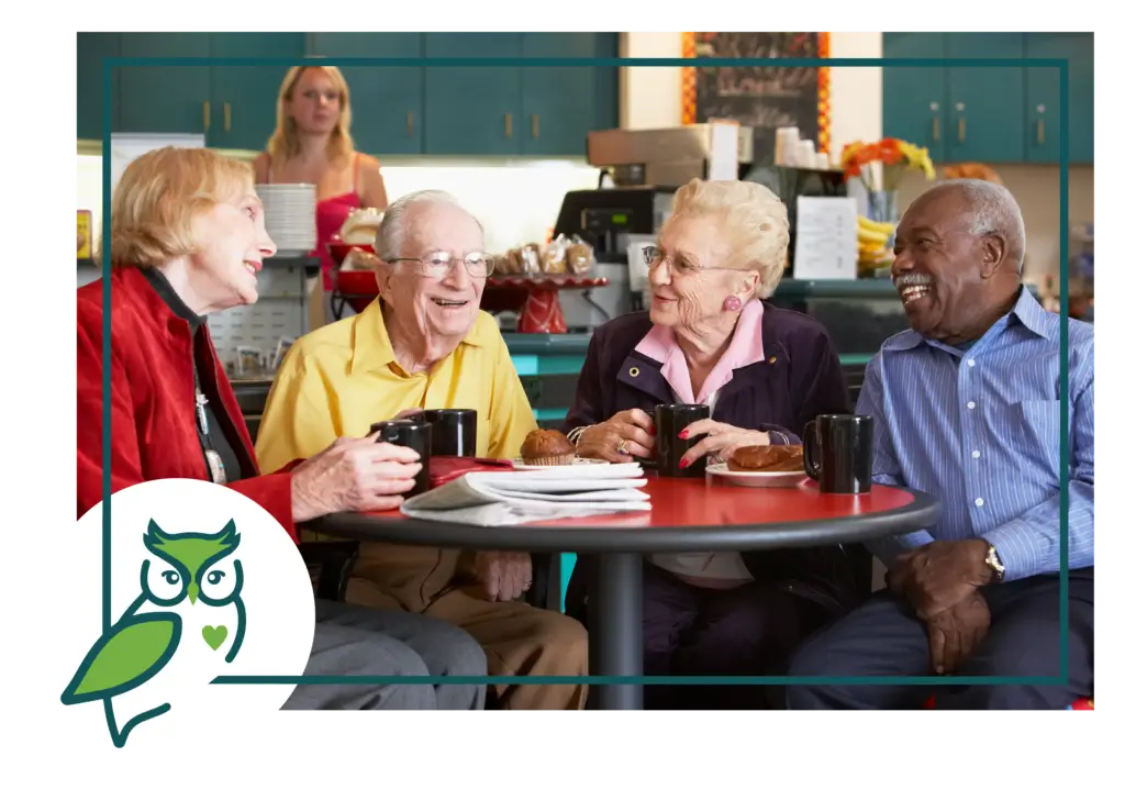 A group of people sitting at a table with drinks.
